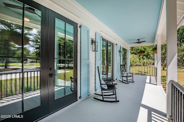 view of patio with ceiling fan, covered porch, and french doors