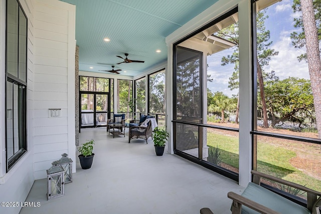 sunroom featuring ceiling fan