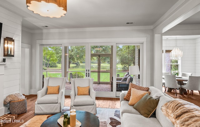 575 Distant Island Dr, Beaufort, SC 29907 - living area featuring a chandelier, healthy amount of natural light, wood finished floors, and french doors