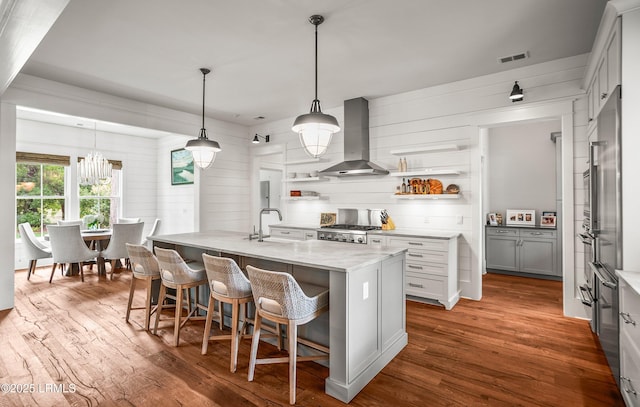 575 Distant Island Dr, Beaufort, SC 29907 - kitchen with wall chimney exhaust hood, open shelves, range, dark wood-style flooring, and wood walls