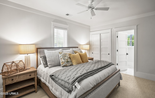 575 Distant Island Dr, Beaufort, SC 29907 - bedroom with multiple windows, a closet, ceiling fan, and connected bathroom