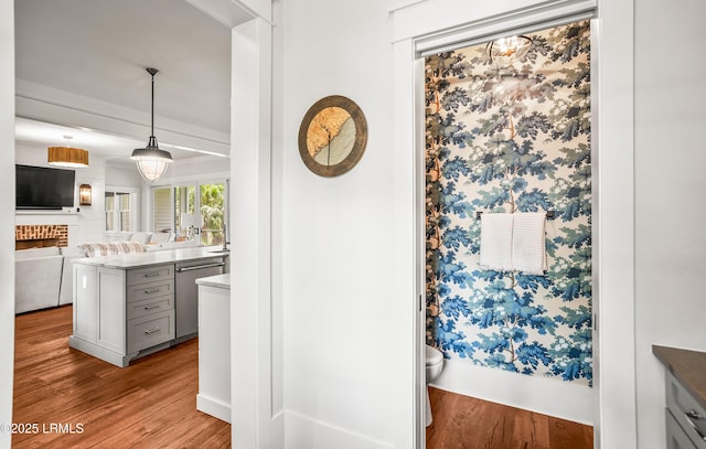575 Distant Island Dr, Beaufort, SC 29907 - kitchen with stainless steel dishwasher, wood finished floors, open floor plan, and decorative light fixtures