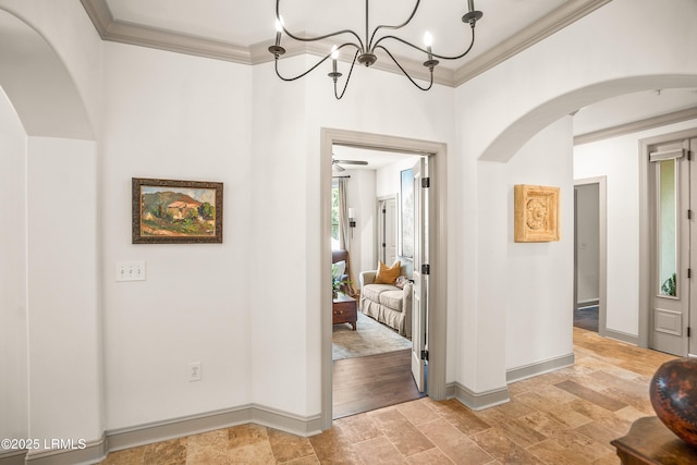15 Sunset Blvd Unit 1201, Beaufort, SC 29907 - corridor with arched walkways, crown molding, light stone finish floors, and a chandelier