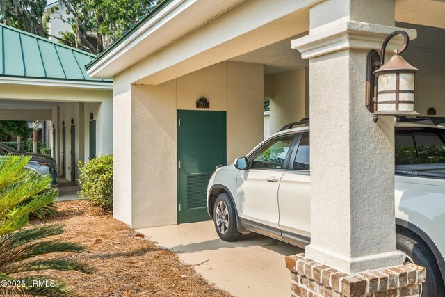 15 Sunset Blvd Unit 1201, Beaufort, SC 29907 - entrance to property featuring a standing seam roof, stucco siding, and a metal roof