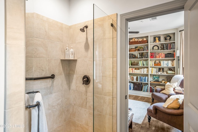 15 Sunset Blvd Unit 1201, Beaufort, SC 29907 - full bathroom featuring wood finished floors and a tile shower