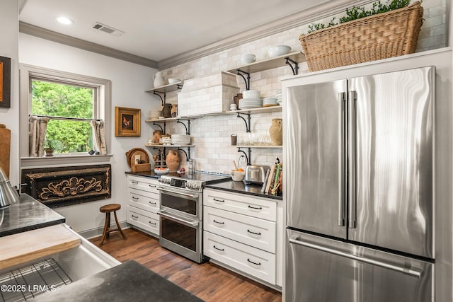 15 Sunset Blvd Unit 1201, Beaufort, SC 29907 - kitchen featuring appliances with stainless steel finishes, dark countertops, open shelves, tasteful backsplash, and crown molding