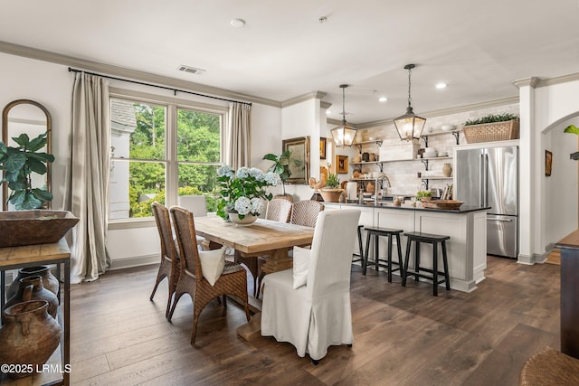 15 Sunset Blvd Unit 1201, Beaufort, SC 29907 - dining area featuring crown molding, dark wood-style floors, recessed lighting, and arched walkways