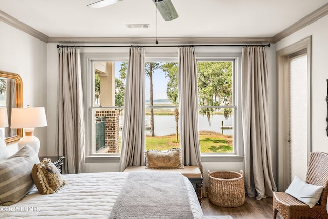 15 Sunset Blvd Unit 1201, Beaufort, SC 29907 - bedroom featuring ornamental molding, wood finished floors, multiple windows, a water view, and a ceiling fan