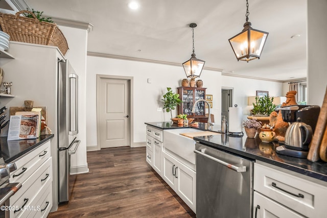 15 Sunset Blvd Unit 1201, Beaufort, SC 29907 - kitchen featuring appliances with stainless steel finishes, ornamental molding, dark countertops, white cabinets, and dark wood finished floors