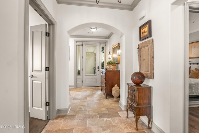 15 Sunset Blvd Unit 1201, Beaufort, SC 29907 - hallway featuring ornamental molding, arched walkways, and light stone finish floors