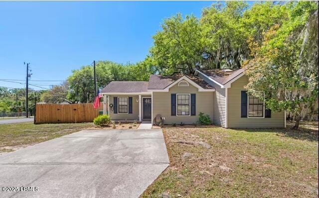 ranch-style house with a front lawn