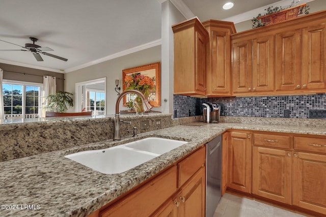 kitchen featuring sink, light tile patterned floors, stainless steel dishwasher, ornamental molding, and light stone countertops