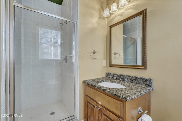 bathroom with vanity and an enclosed shower