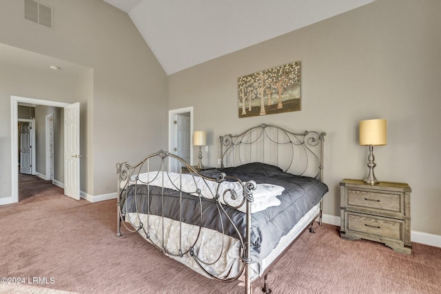 bedroom with carpet flooring and vaulted ceiling