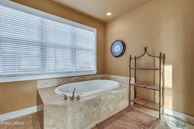 bathroom with tiled tub