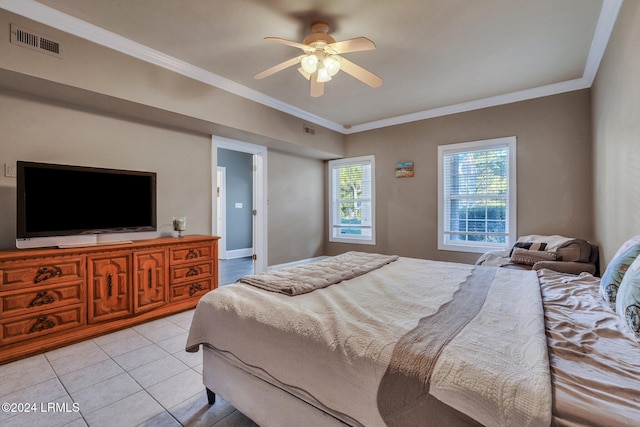 bedroom featuring ceiling fan, ornamental molding, and light tile patterned floors