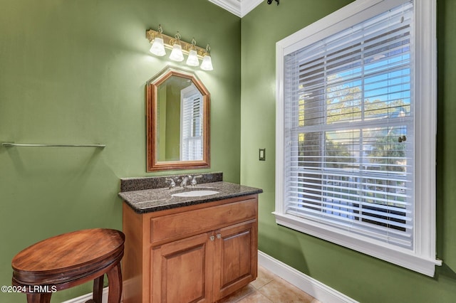 bathroom with vanity, crown molding, and tile patterned floors