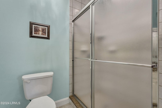 bathroom with toilet and walk in shower