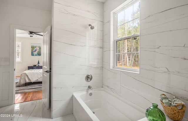 full bathroom with a tub and ensuite bath