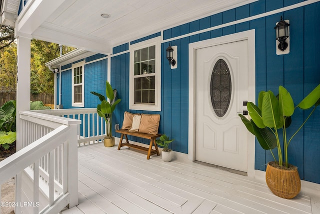 view of exterior entry with covered porch