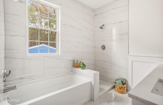 full bath with a garden tub, a marble finish shower, and a wealth of natural light