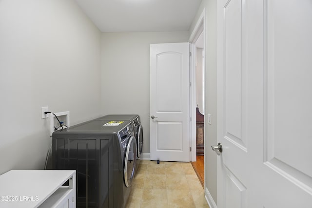 laundry room with washer and clothes dryer