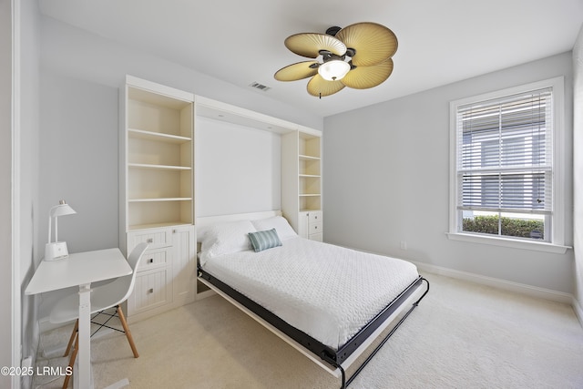 bedroom featuring light carpet and ceiling fan