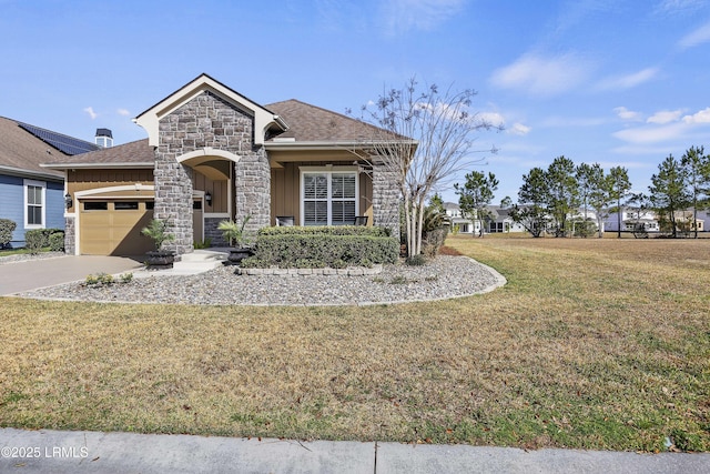 view of front of house featuring a garage and a front lawn