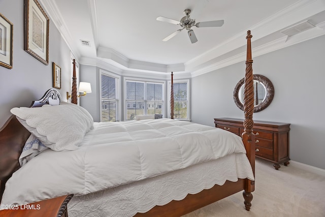 bedroom featuring crown molding, light colored carpet, and ceiling fan