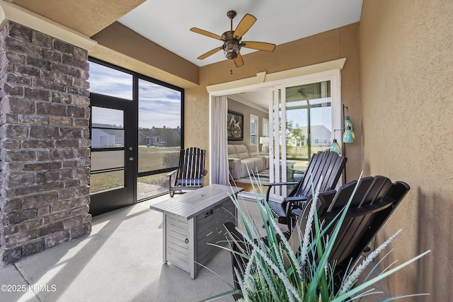 carpeted office featuring ceiling fan