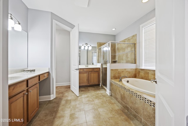 bathroom featuring vanity, separate shower and tub, and tile patterned floors