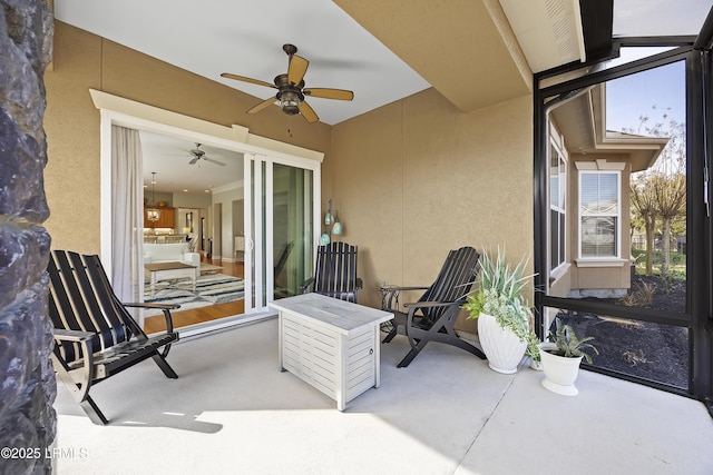 view of patio / terrace featuring ceiling fan
