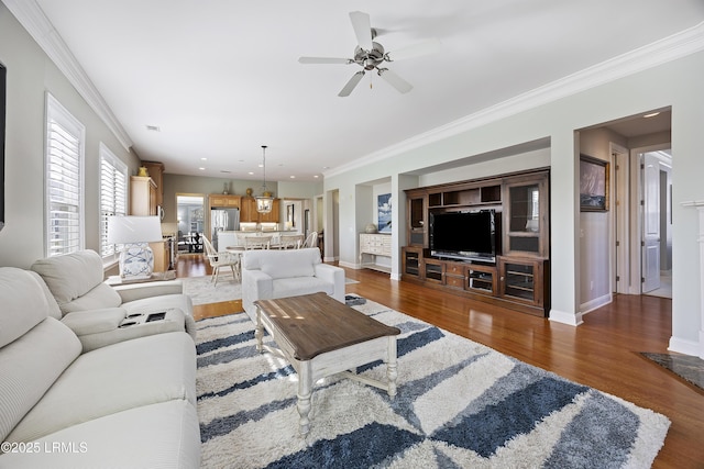 living room featuring ornamental molding, ceiling fan, and dark hardwood / wood-style flooring