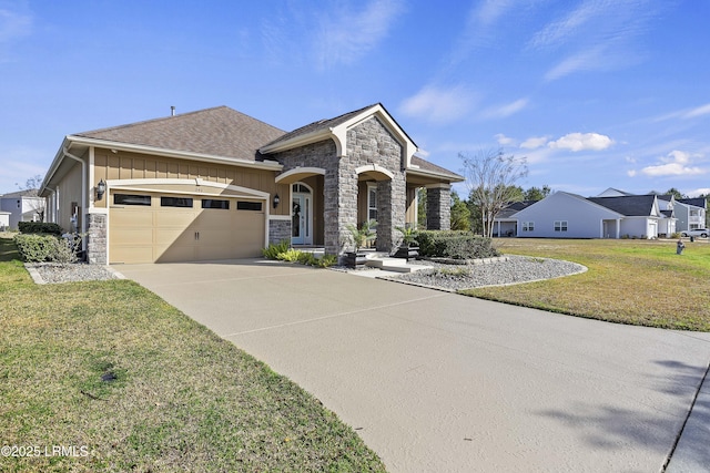 view of front of house featuring a garage and a front yard