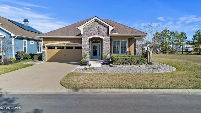 view of front facade with a garage and a front yard