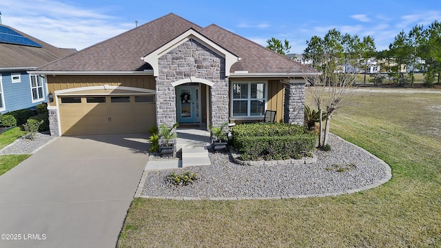 view of front facade featuring a garage and a front lawn