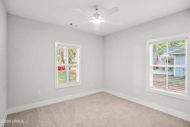 12 Meagan Dr, Beaufort, SC 29907 - empty room with light colored carpet, plenty of natural light, and baseboards
