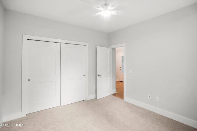 12 Meagan Dr, Beaufort, SC 29907 - unfurnished bedroom with carpet flooring, baseboards, a closet, and ceiling fan
