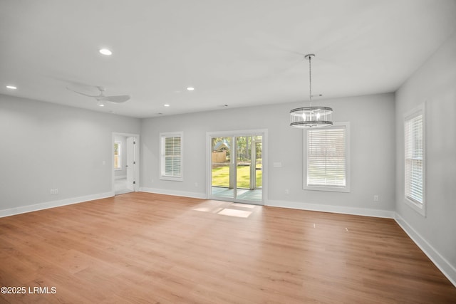 12 Meagan Dr, Beaufort, SC 29907 - empty room featuring recessed lighting, a chandelier, light wood-style flooring, and baseboards