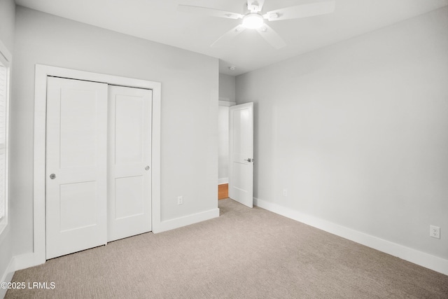 12 Meagan Dr, Beaufort, SC 29907 - unfurnished bedroom with carpet floors, a closet, baseboards, and a ceiling fan