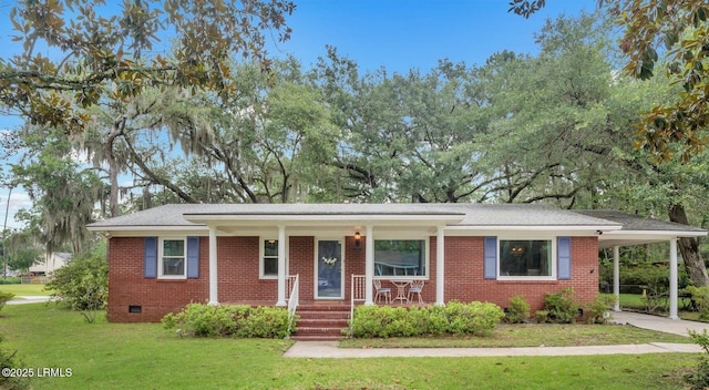 ranch-style house featuring brick siding, covered porch, a front yard, crawl space, and an attached carport