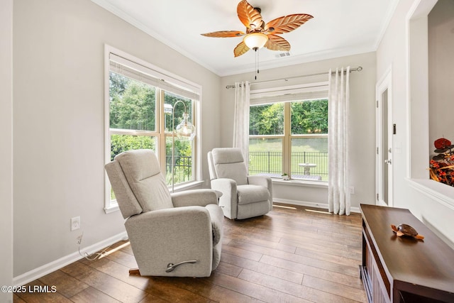 21 Heathrow Ave, Bluffton, SC 29910 - sitting room with dark wood-type flooring, crown molding, and a ceiling fan