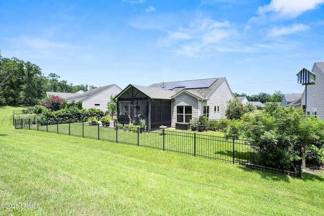 21 Heathrow Ave, Bluffton, SC 29910 - back of property featuring a sunroom, roof mounted solar panels, and a fenced backyard