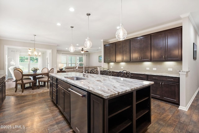 21 Heathrow Ave, Bluffton, SC 29910 - kitchen with dark brown cabinetry, stainless steel dishwasher, ornamental molding, recessed lighting, and healthy amount of natural light