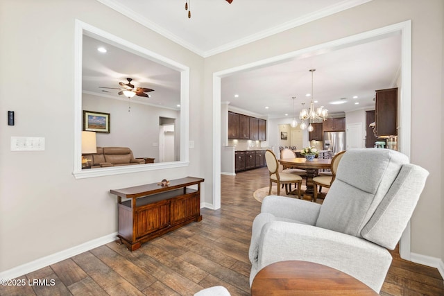21 Heathrow Ave, Bluffton, SC 29910 - living room featuring ceiling fan, ornamental molding, dark wood-style flooring, a chandelier, and recessed lighting