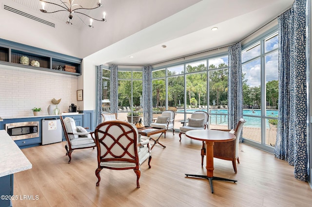 21 Heathrow Ave, Bluffton, SC 29910 - sunroom / solarium featuring healthy amount of natural light and a chandelier
