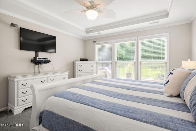 21 Heathrow Ave, Bluffton, SC 29910 - bedroom with a raised ceiling, multiple windows, carpet, and crown molding