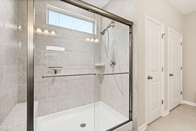 21 Heathrow Ave, Bluffton, SC 29910 - full bathroom featuring a shower stall and baseboards