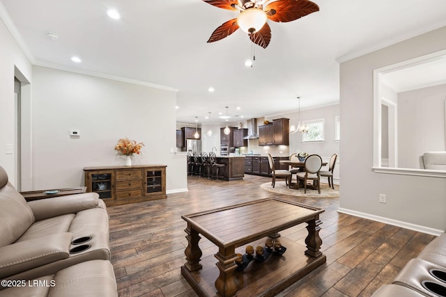 21 Heathrow Ave, Bluffton, SC 29910 - living area with a ceiling fan, recessed lighting, ornamental molding, and dark wood-style flooring