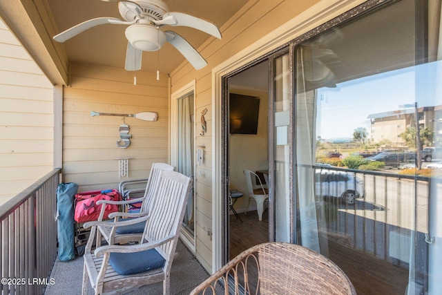 balcony featuring ceiling fan